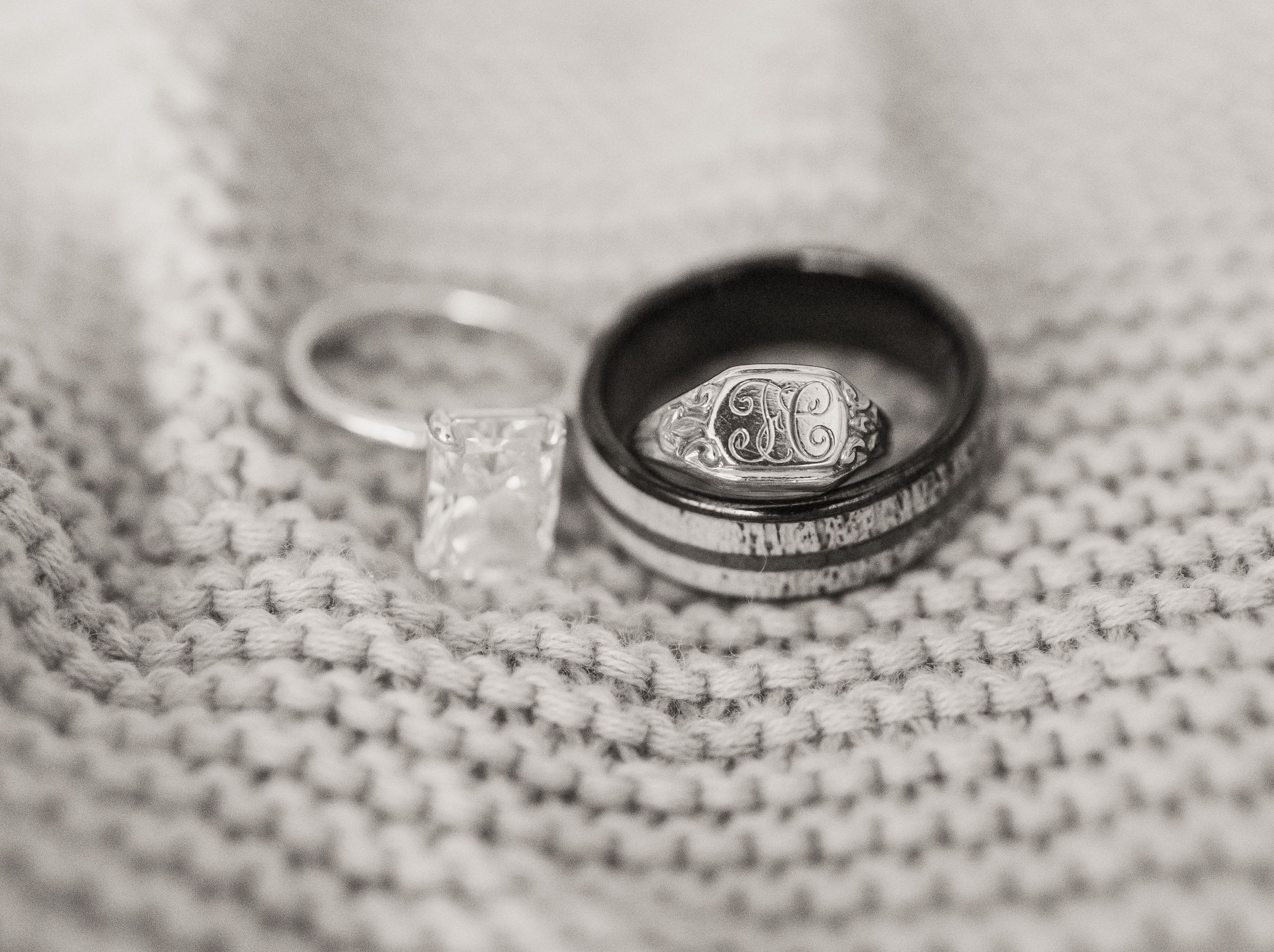 Wedding rings displayed in a sequence of close-up shots on a textured white knit fabric background.