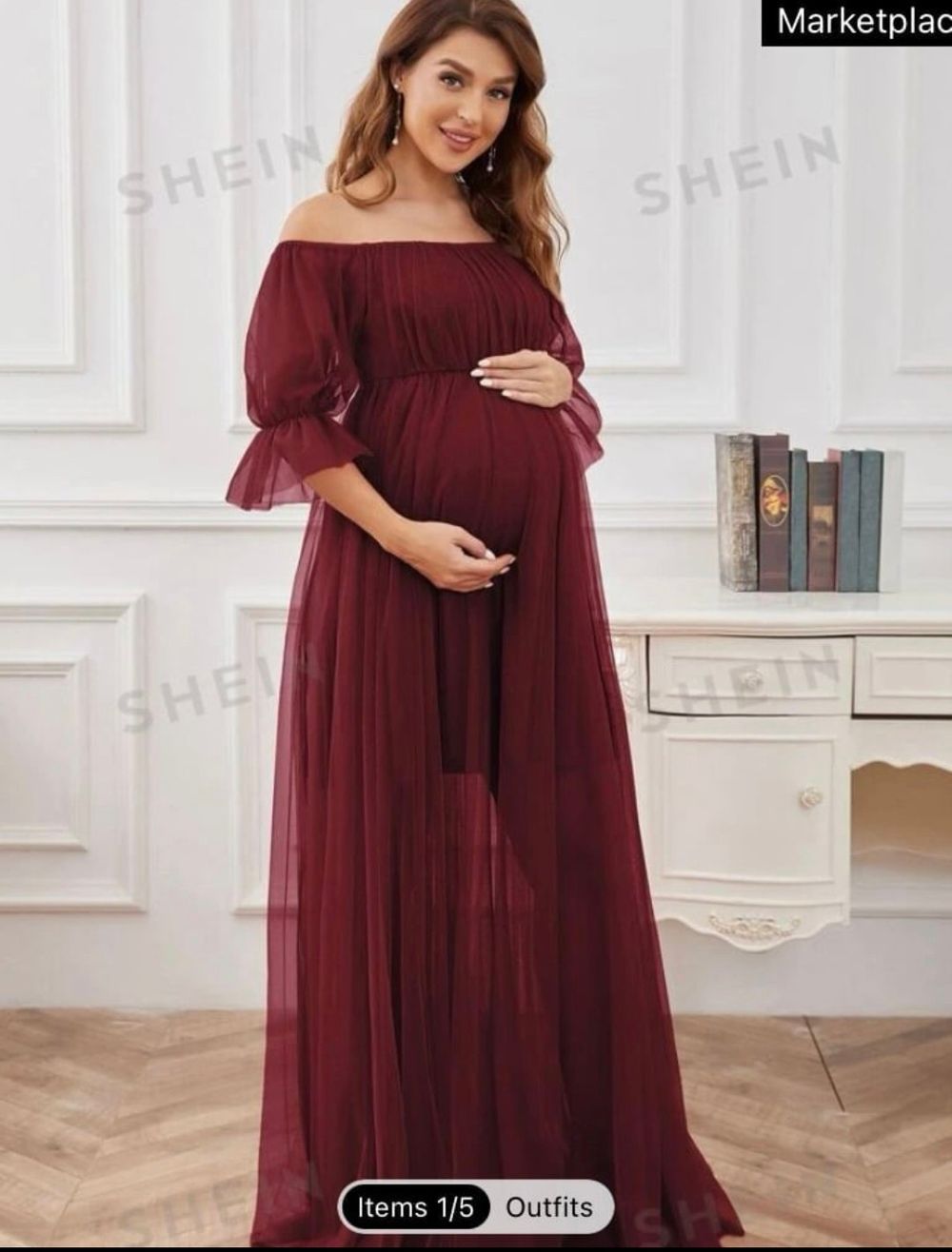 Pregnant woman wearing a burgundy off-shoulder maxi dress with puff sleeves and flowing tulle skirt from SHEIN.