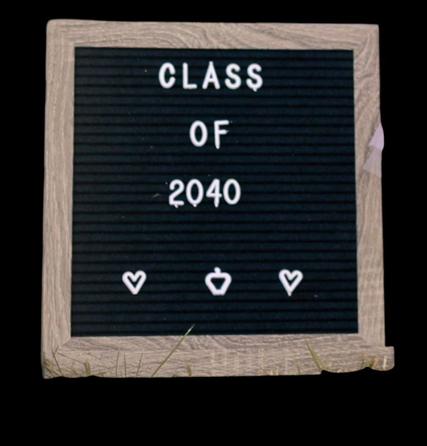 A black letter board displays 'CLASS OF 2040' in white letters against a wooden frame.