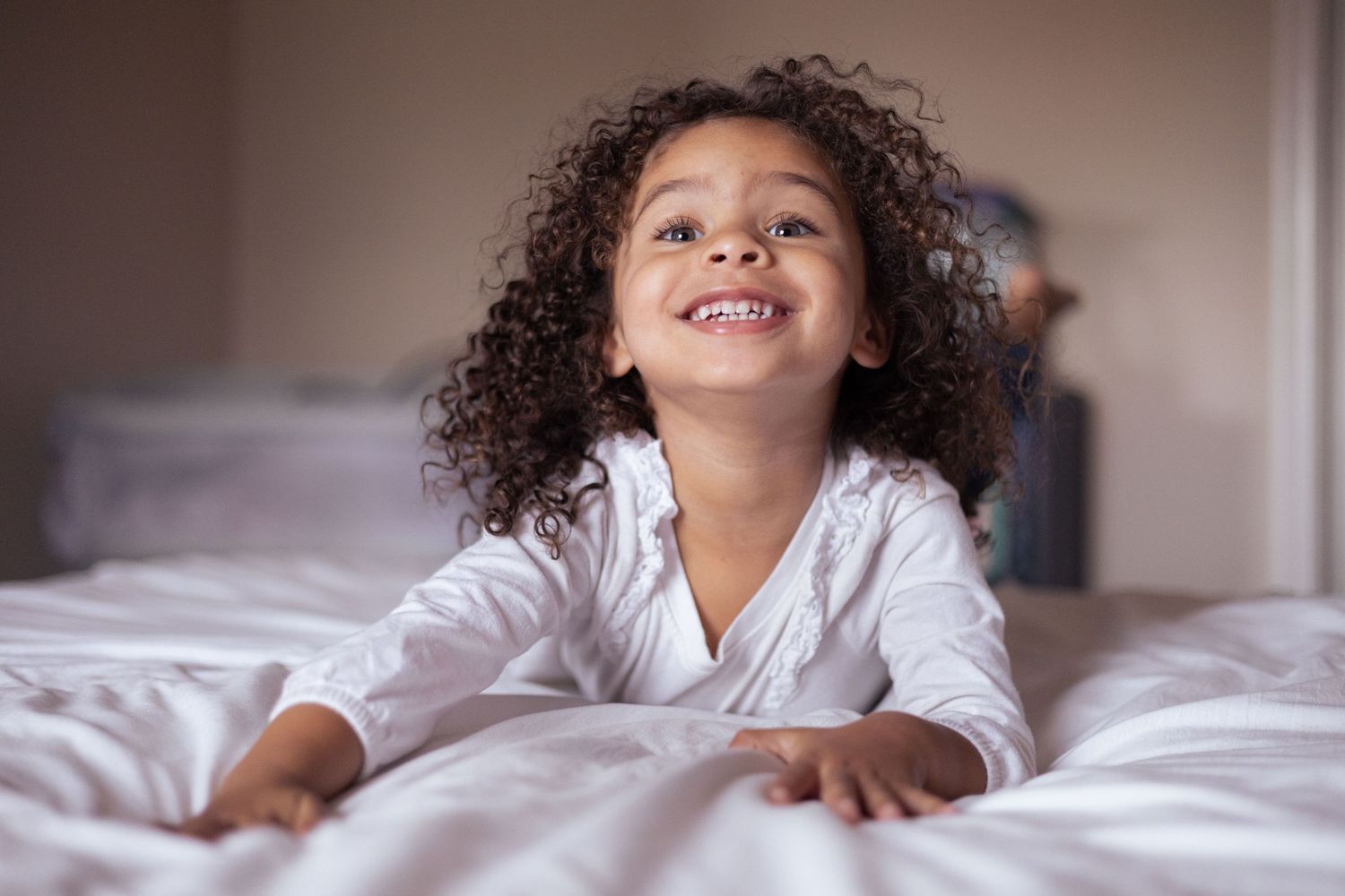 A little girl excitedly poses for the camera.