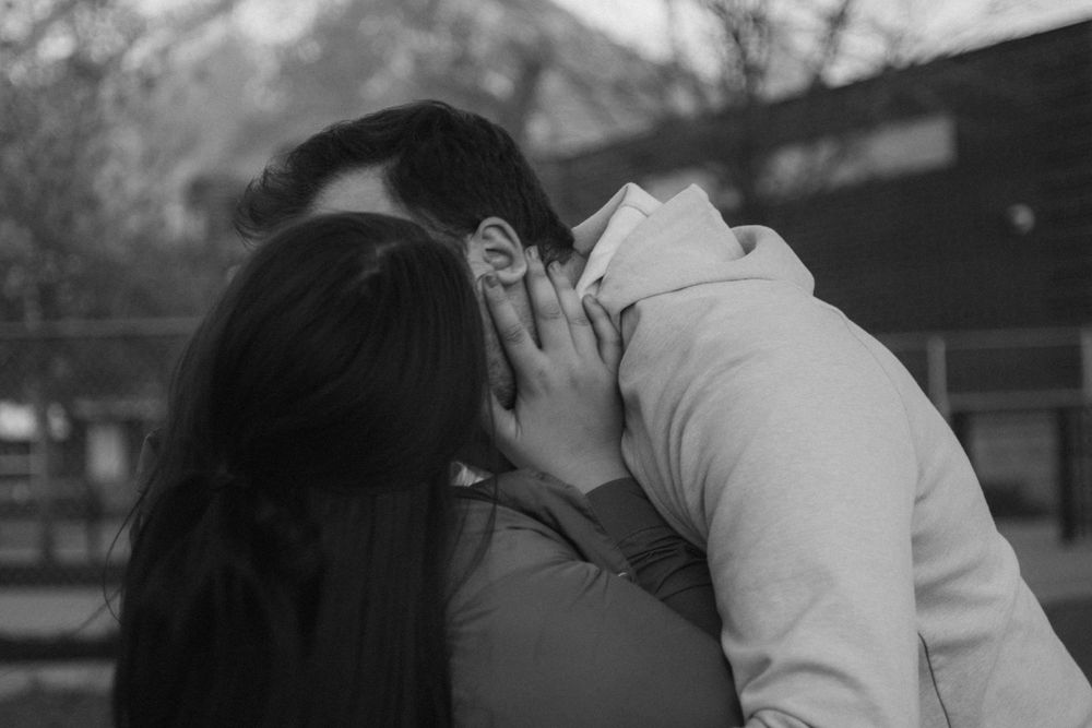Couple kisses in Provo park.