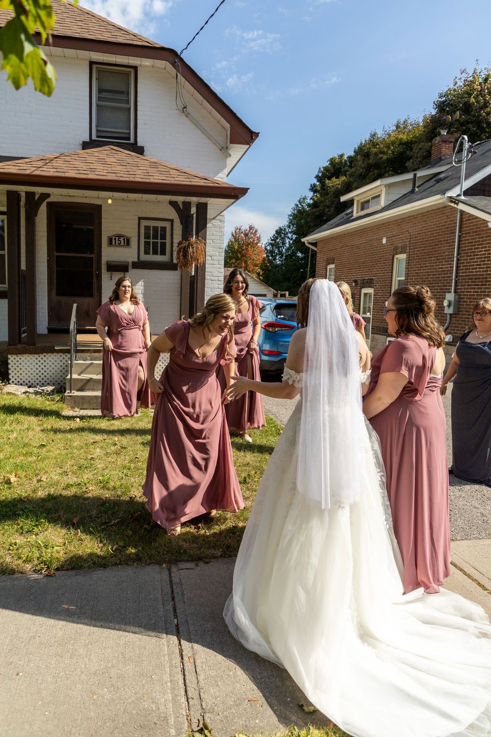 bridesmaids admiring the bride after revealing her final look