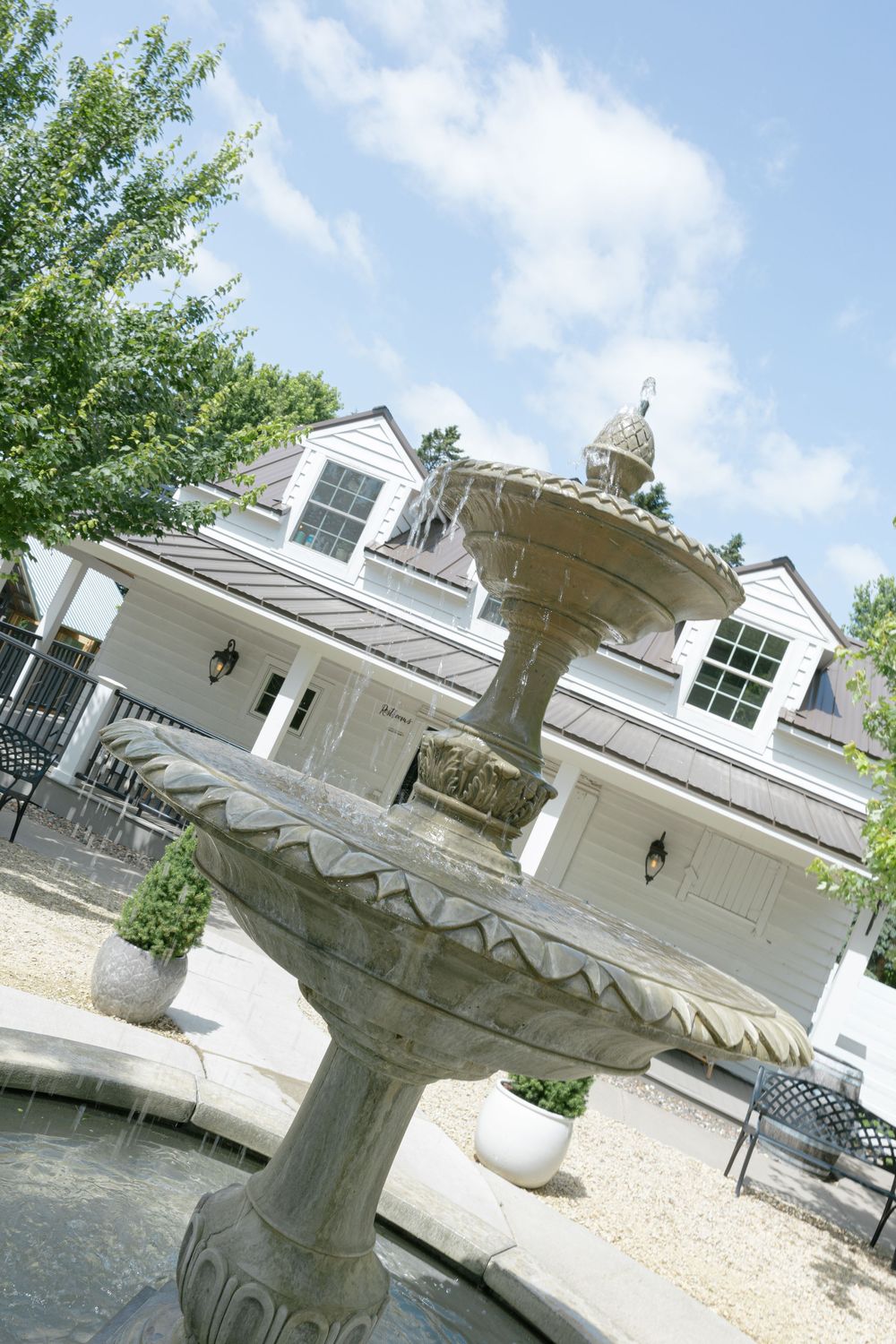 A series of tilted architectural detail shots showing a decorative white pillar or column against a residential building exterior.