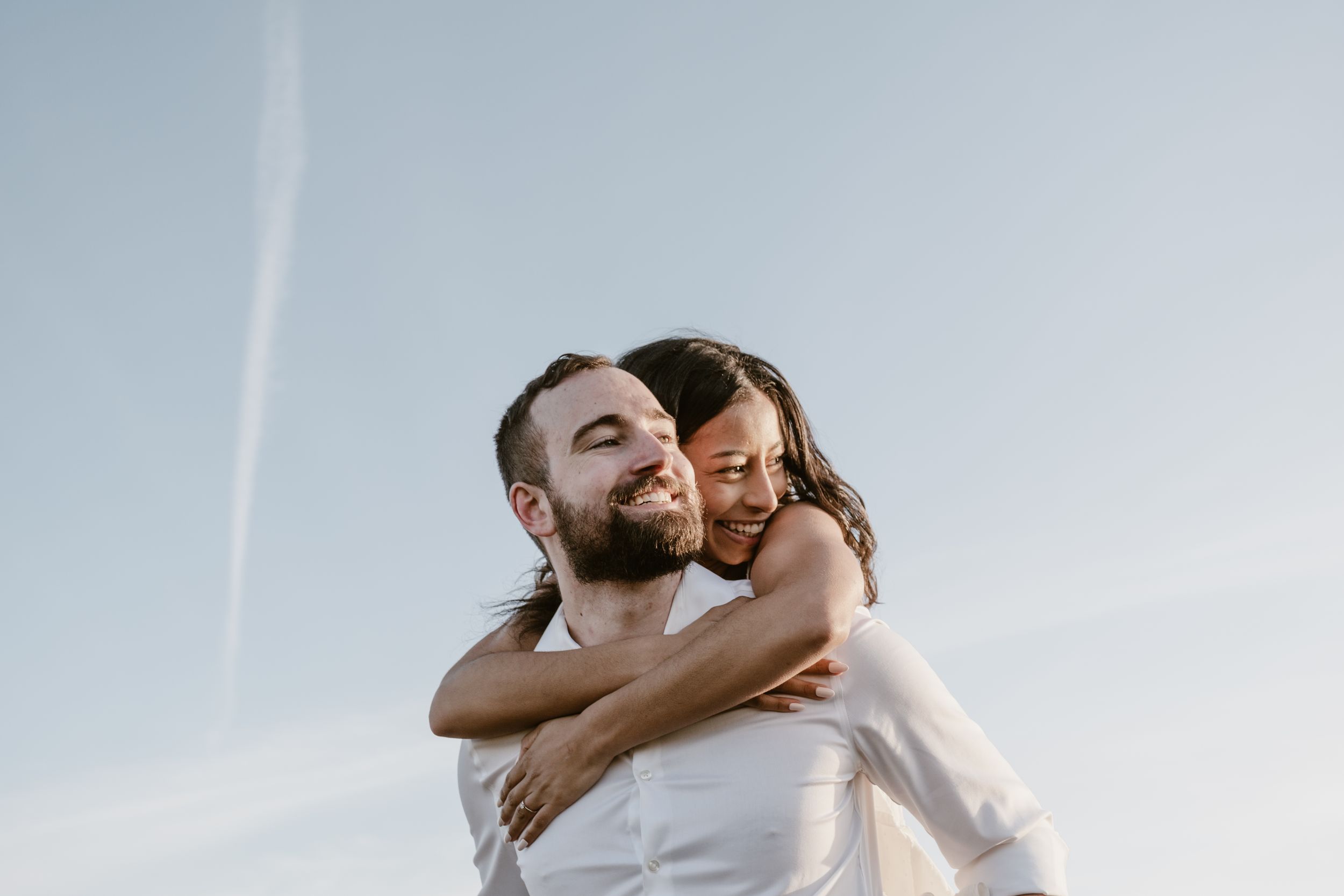 engaged couple piggyback.