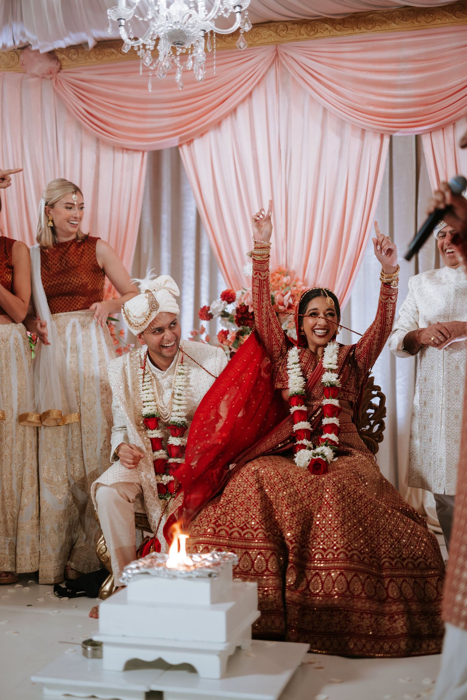 Elegant South Asian wedding at Downtown Marriott Philadelphia, with the couple glowing beneath a stunning floral mandap.