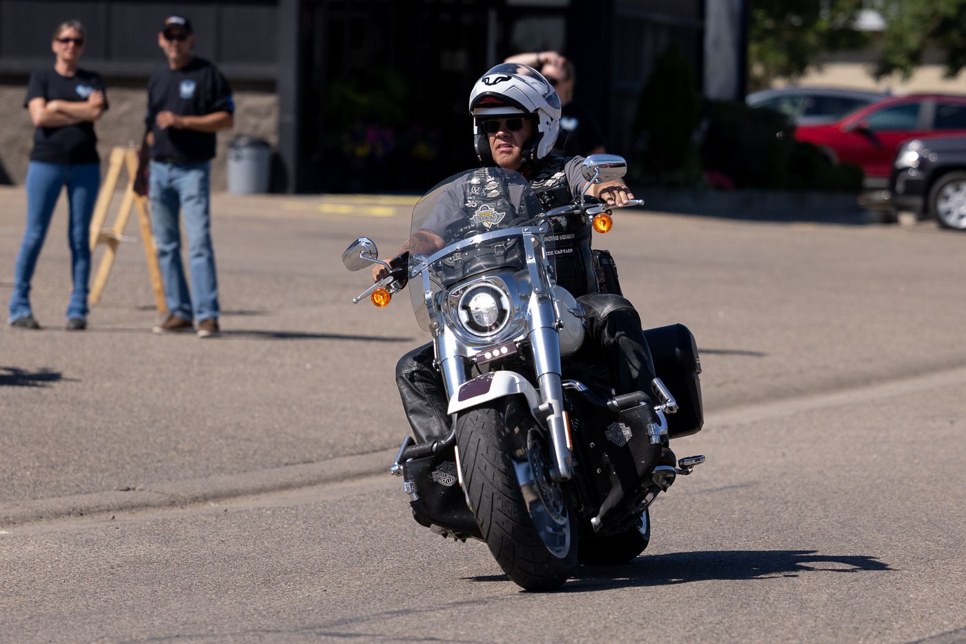 Close-up views of multiple motorcycles parked at a motorcycle gathering, showing chrome details and custom bikes.