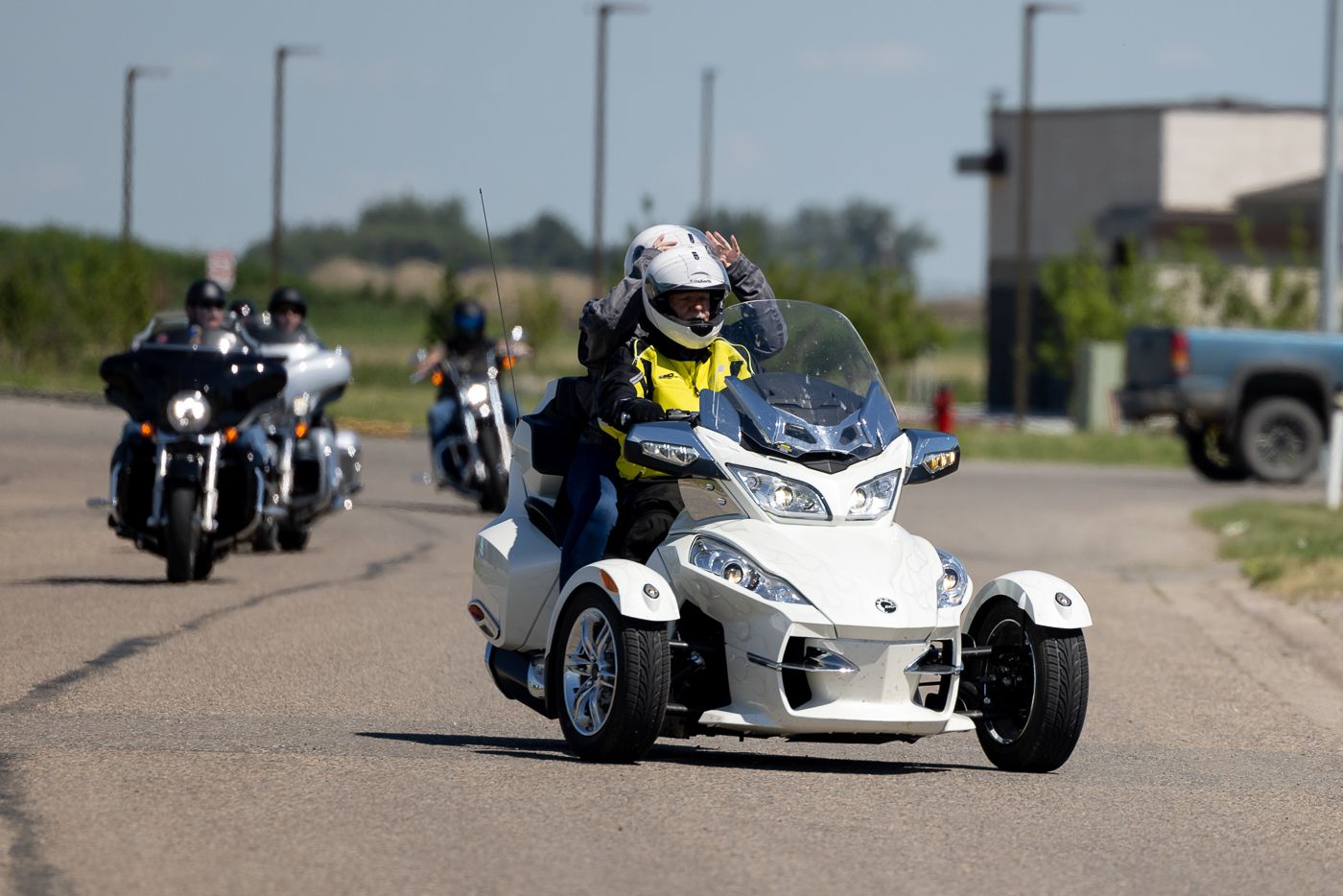 A series of motorcycle sidecars racing on a track, showcasing different angles and racing positions during competition.