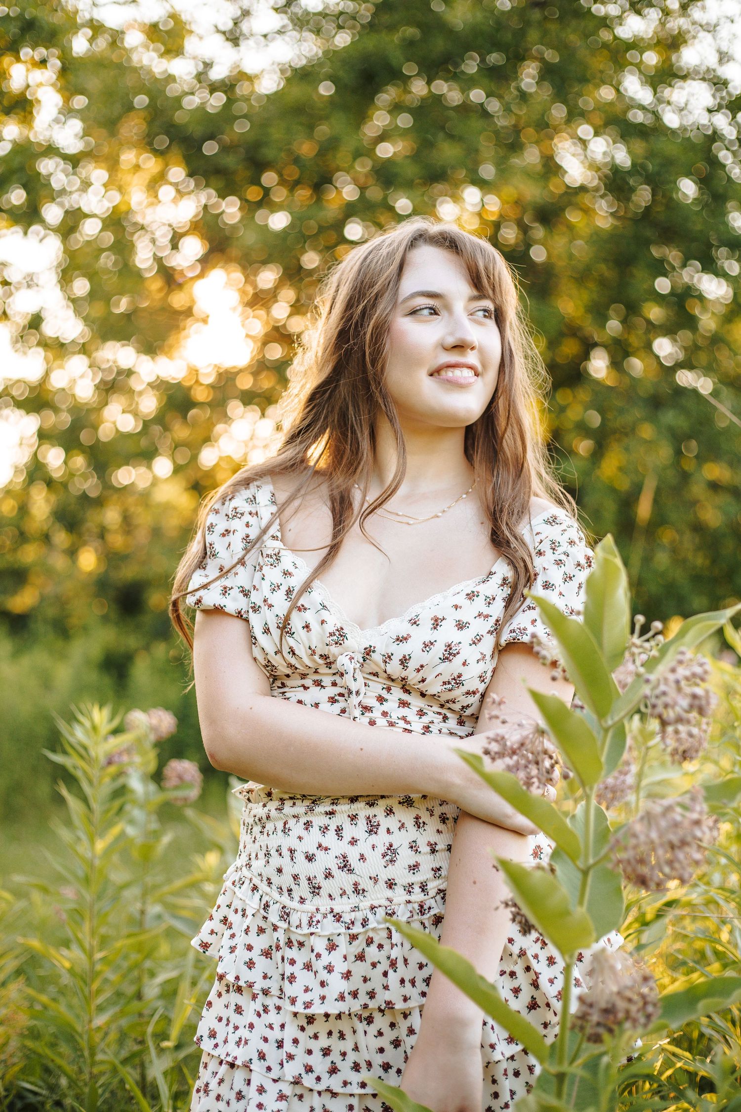 senior portait in a field by Judith Olson Photography