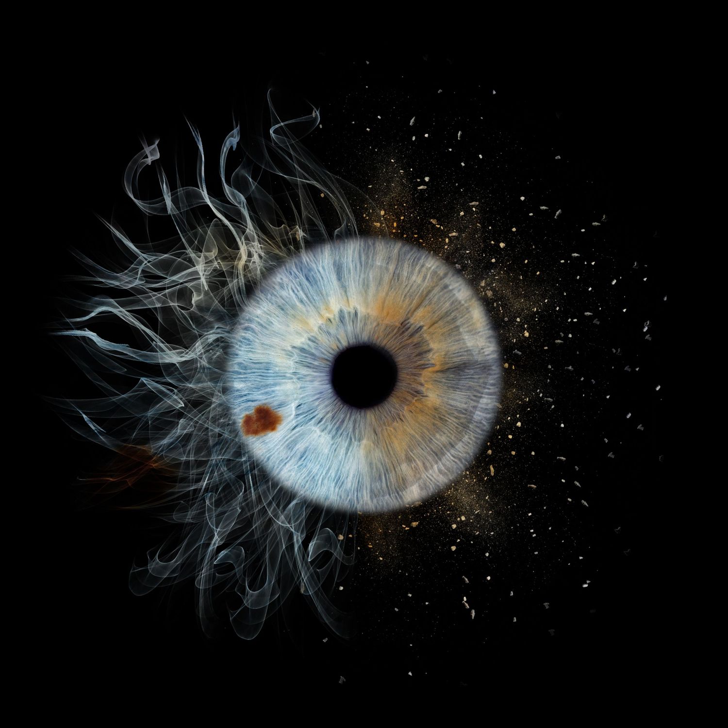 Abstract digital art reveals a blue human eye dissolving into wispy tendrils against a dark background with glittering particles.