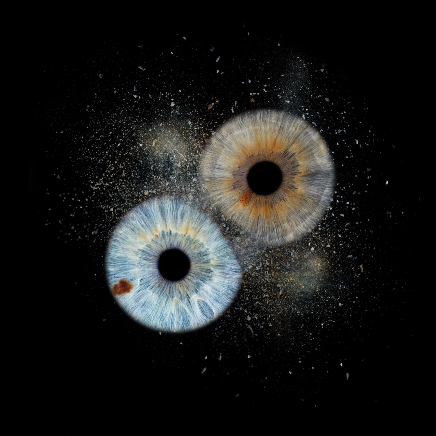 Composite image showing an artistic series of blue and orange galactic iris patterns in a dark void background.