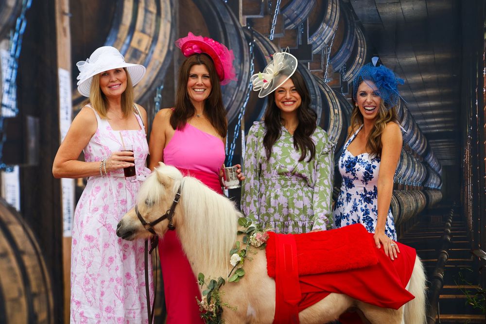 People in colorful dresses gathered at a social event.