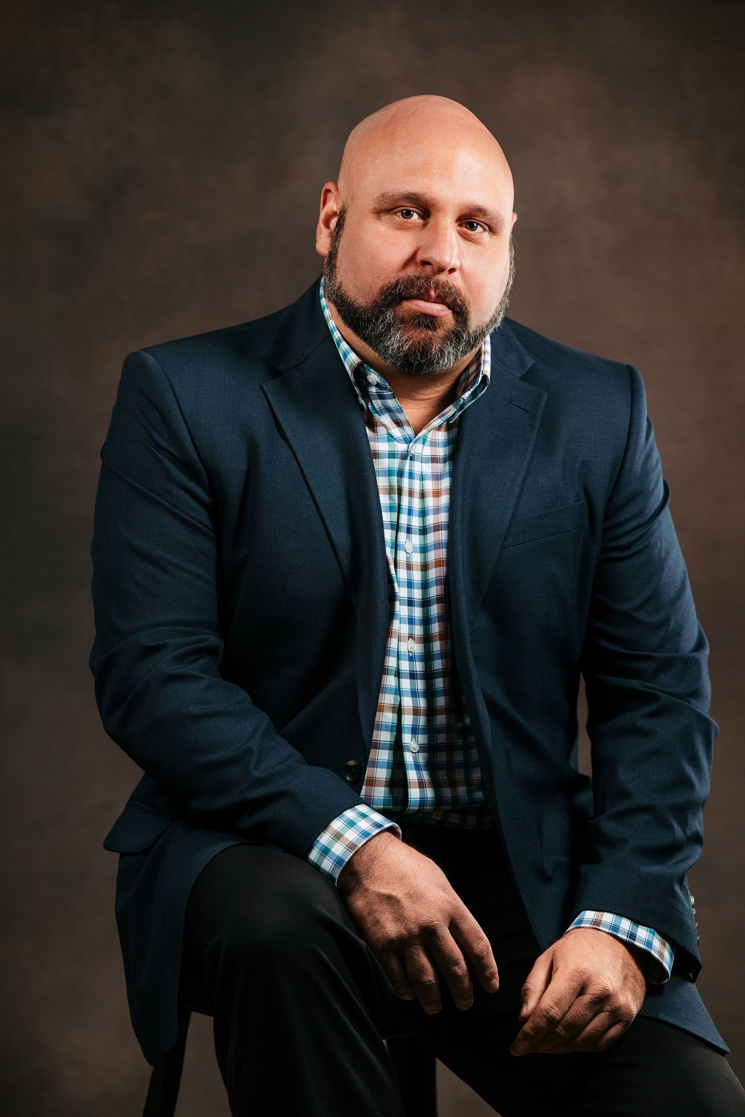 Professional headshot of a Middle Tennessee business professional in a studio setting with clean lighting and a neutral background