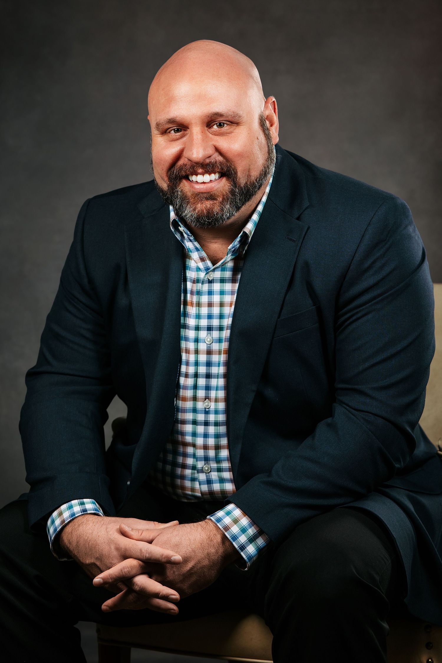 Studio headshot of a Middle Tennessee professional photographed with professional lighting and guided posing