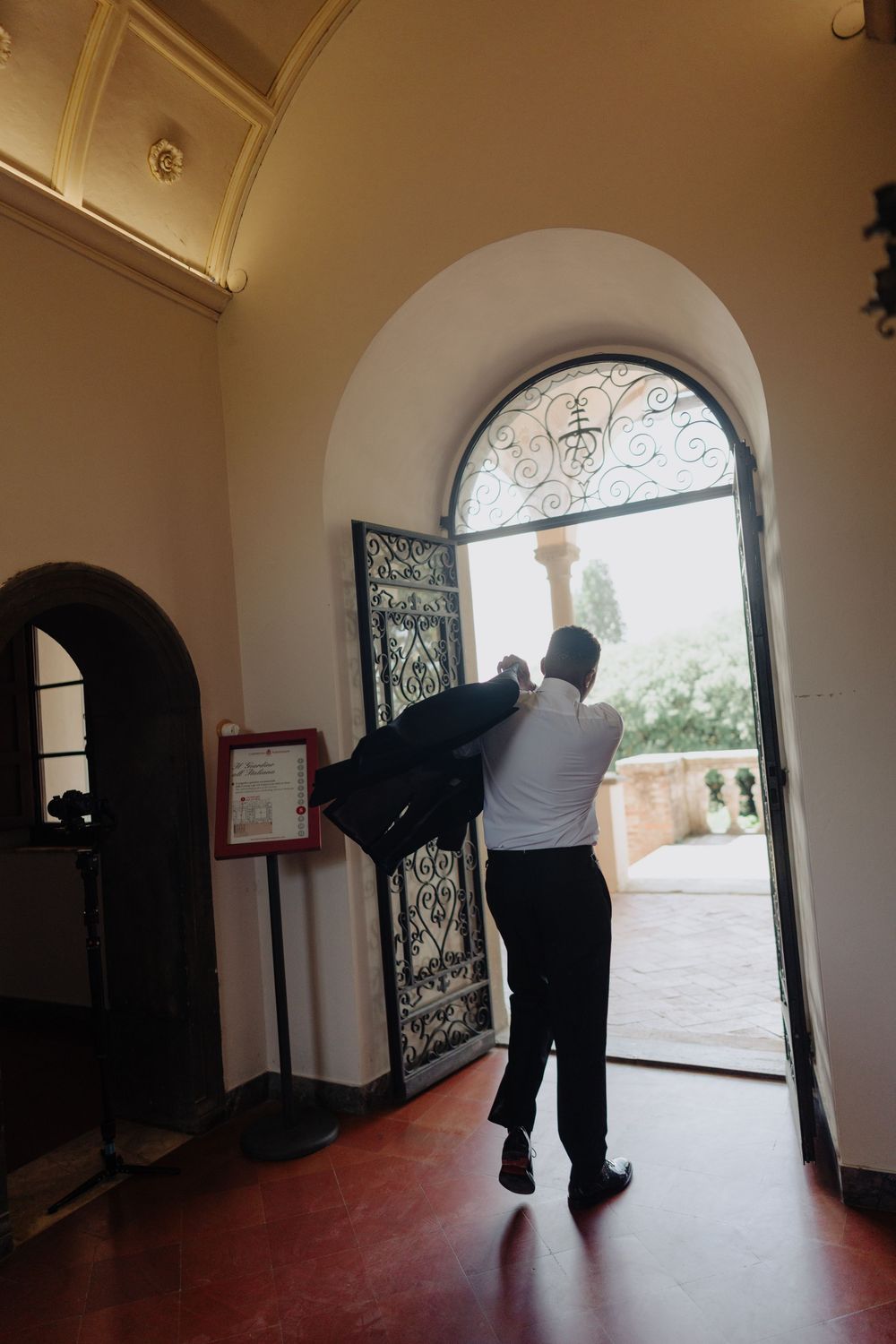 Series of photos showing an arched doorway entrance with decorative ironwork from inside a historic building.
