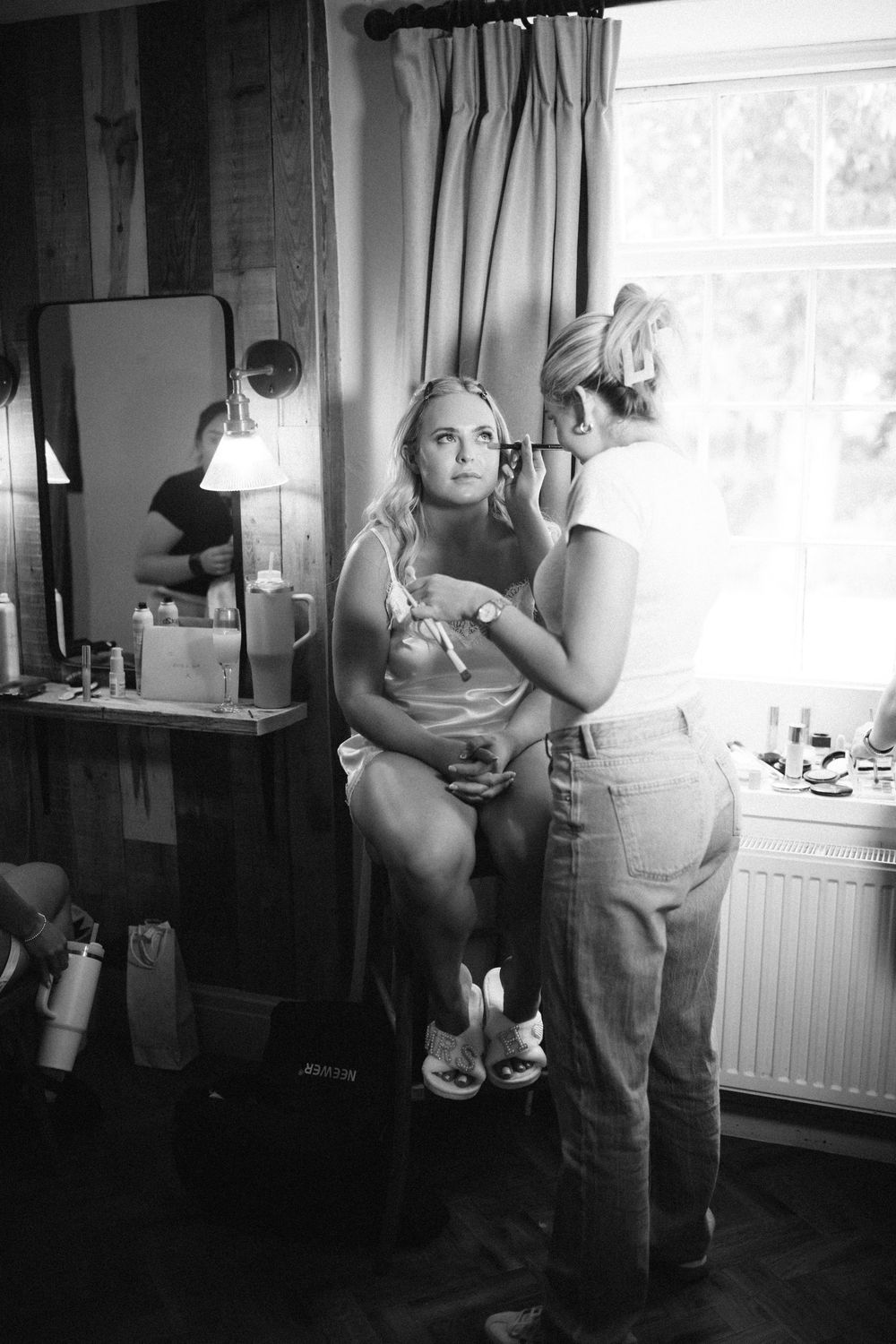 Black and white photos capture intimate getting ready moments before the wedding.
