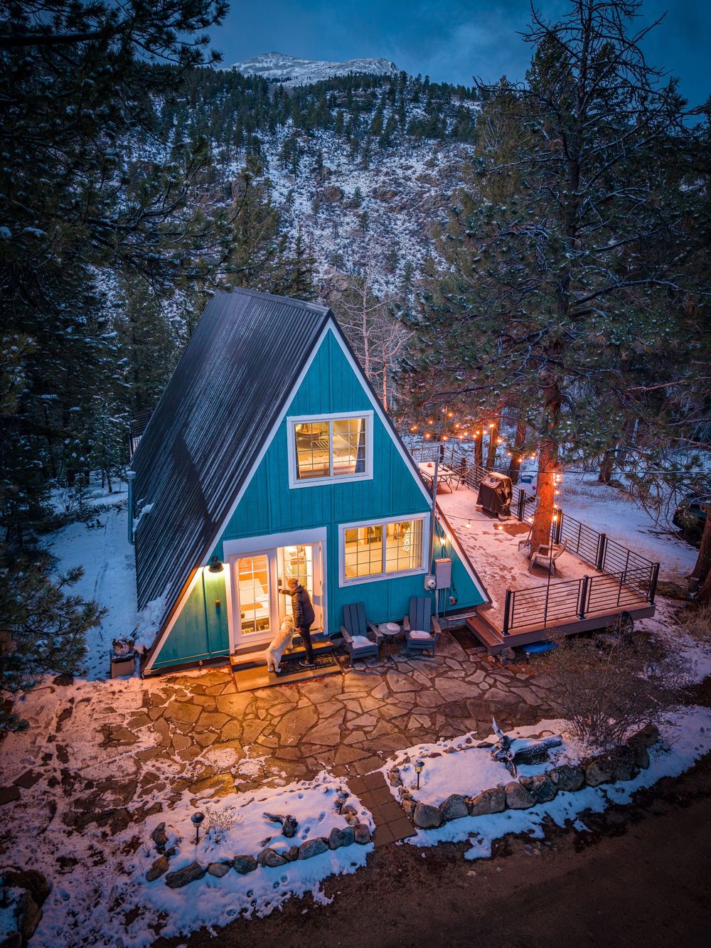Aerial shot of a man and his dog at the Hygge Chalet by Denver Hospitality, Travel & Tourism photographer Captain Colorado Photography.