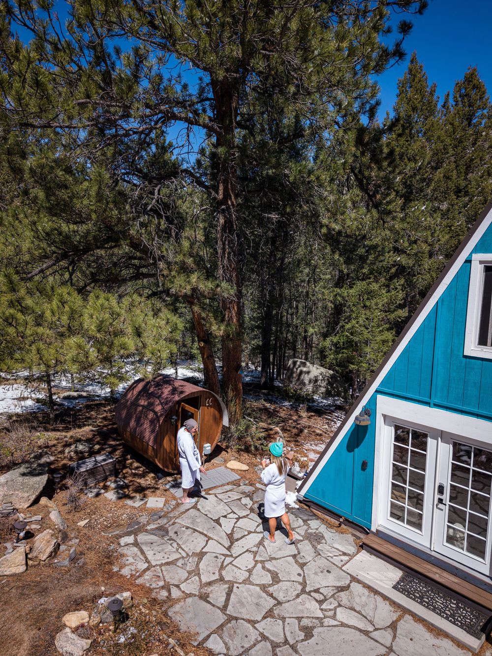Aerial shot of a couple and sauna at the Hygge Chalet by Denver Hospitality, Travel & Tourism photographer Captain Colorado Photography.
