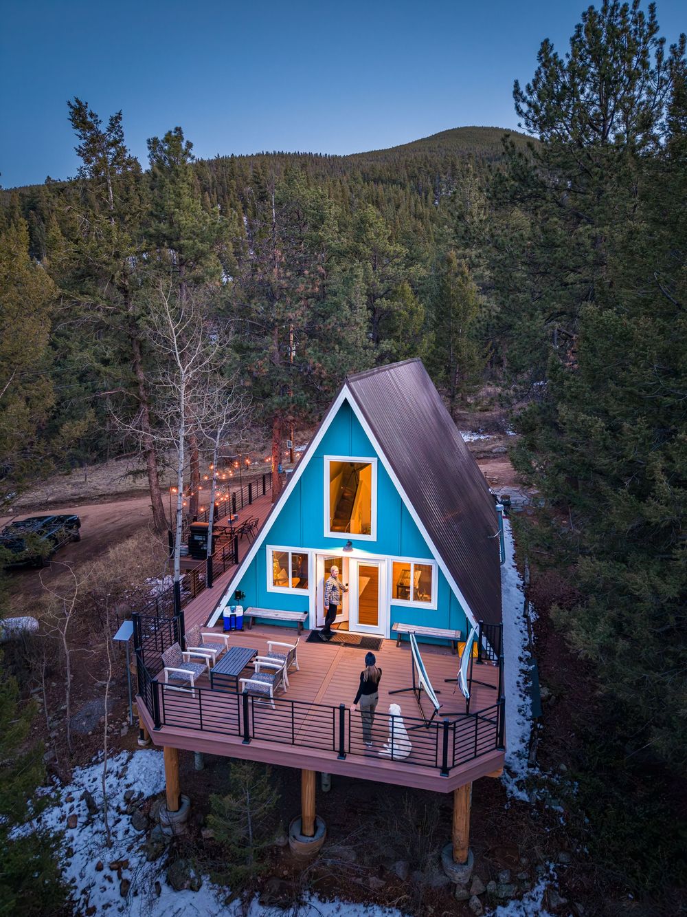Aerial shot of a couple on the deck at the Hygge Chalet by Denver Hospitality, Travel & Tourism photographer Captain Colorado Photography.