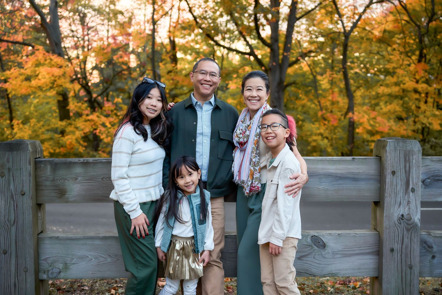 Fall family portrait in Queens park with queens photographer