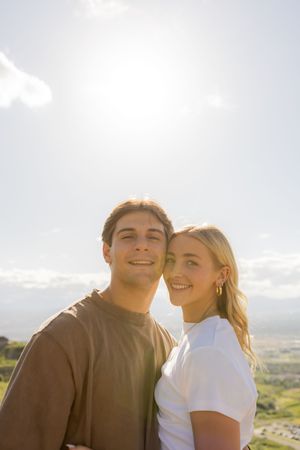 ouple smiling together at golden hour during a Utah couples photo session