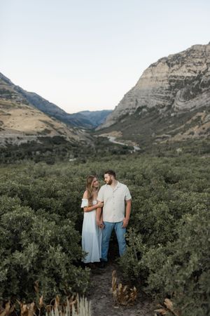 Couple standing together in a Utah canyon during an intimate couples photography session