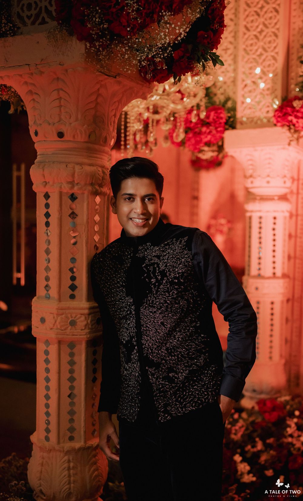 Wedding photography series featuring formal portraits in a venue with ornate pillars and red ambient lighting.