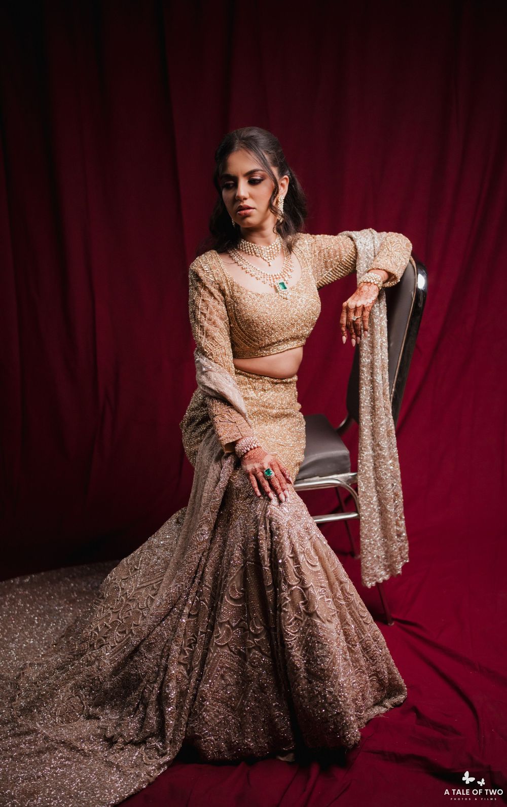 A person in a beige sequined gown poses gracefully against a deep red velvet backdrop in a series of elegant shots.