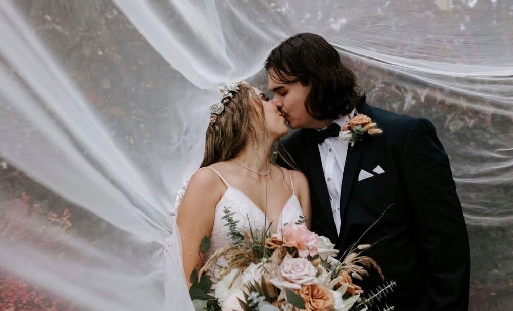 A romantic wedding couple shares intimate moments under flowing white fabric in a series of artistic photographs.