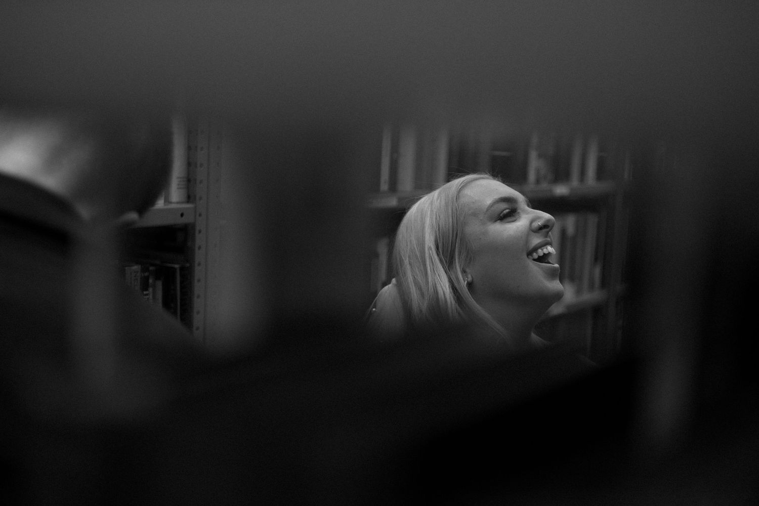 A series of black and white film stills showing dramatic expressions and emotional moments in low lighting.