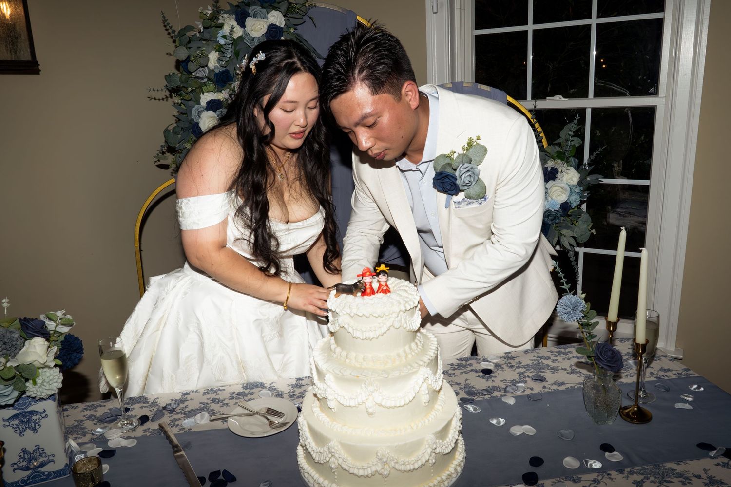 couple cutting wedding cake