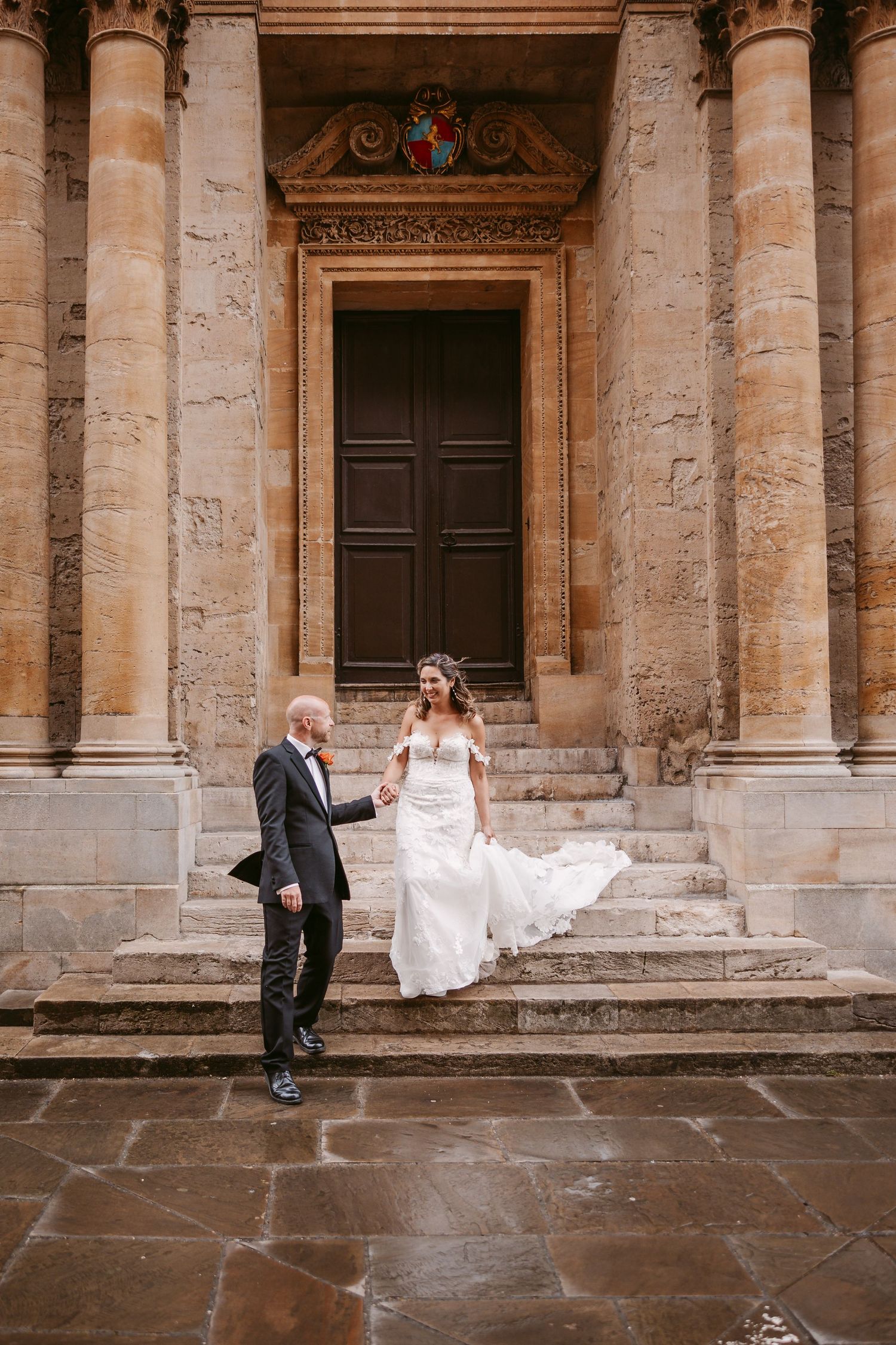 A sequence of wedding photos showing a couple playfully interacting against a historic stone building facade.
