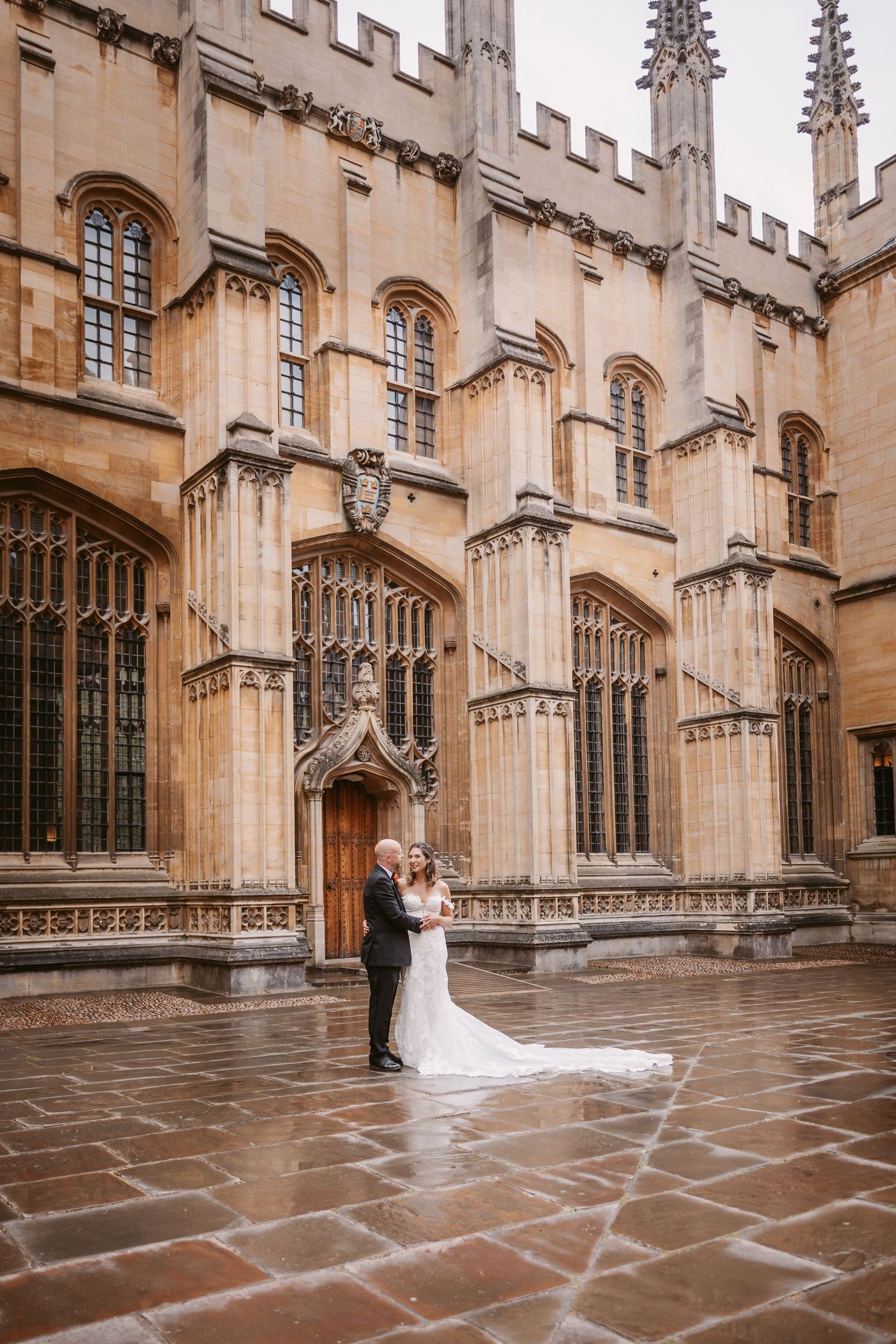 Gothic stone architecture and archways frame a romantic scene at Oxford University's historic courtyard.
