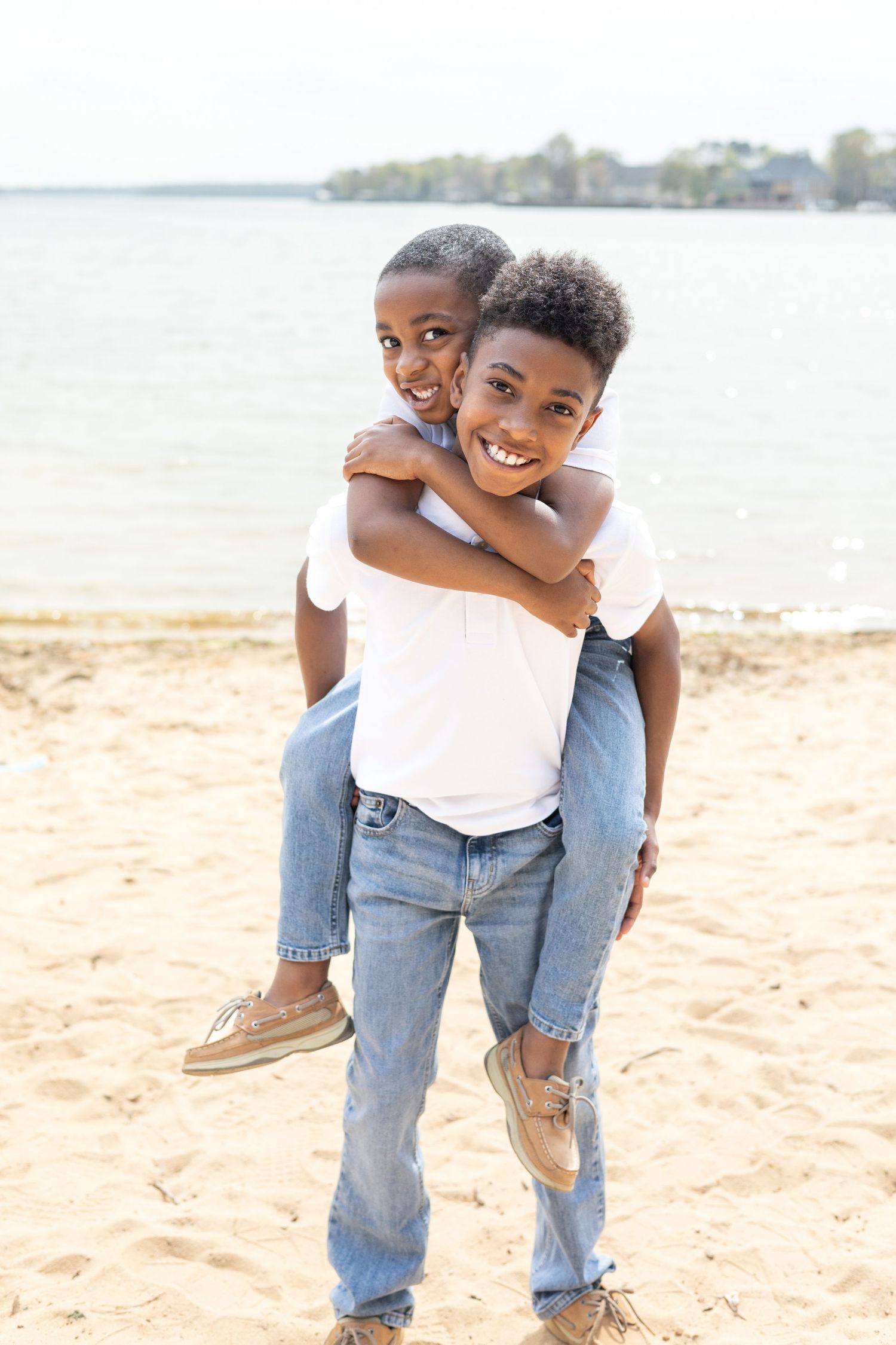 Brother's playing in the sand at Jetton Park in Cornelius for a family photo shoot.