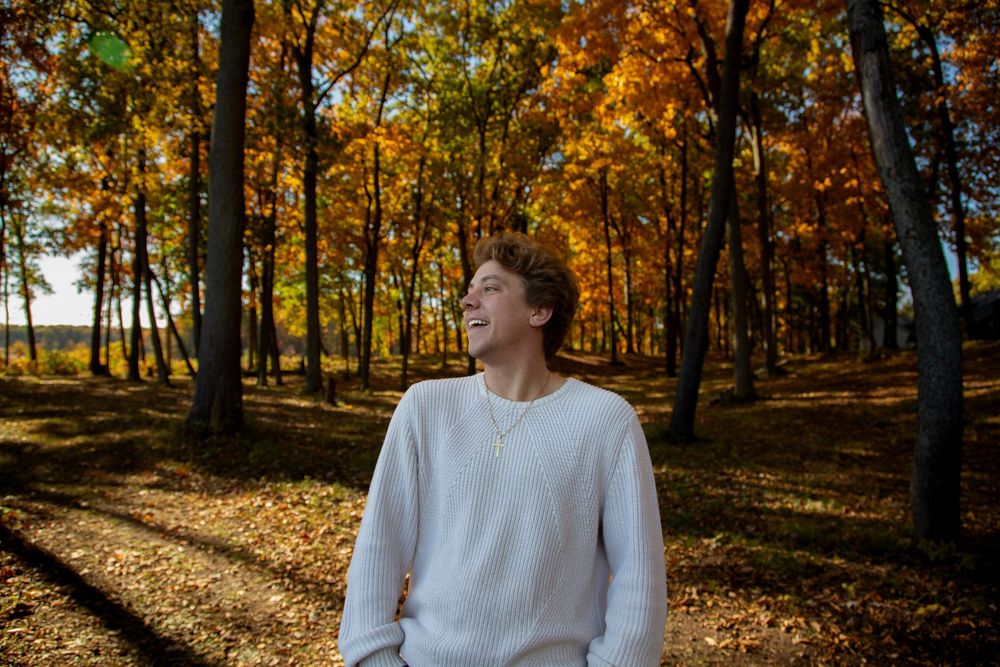 Michigan senior fall photo shoot in woods with bright true to color editing