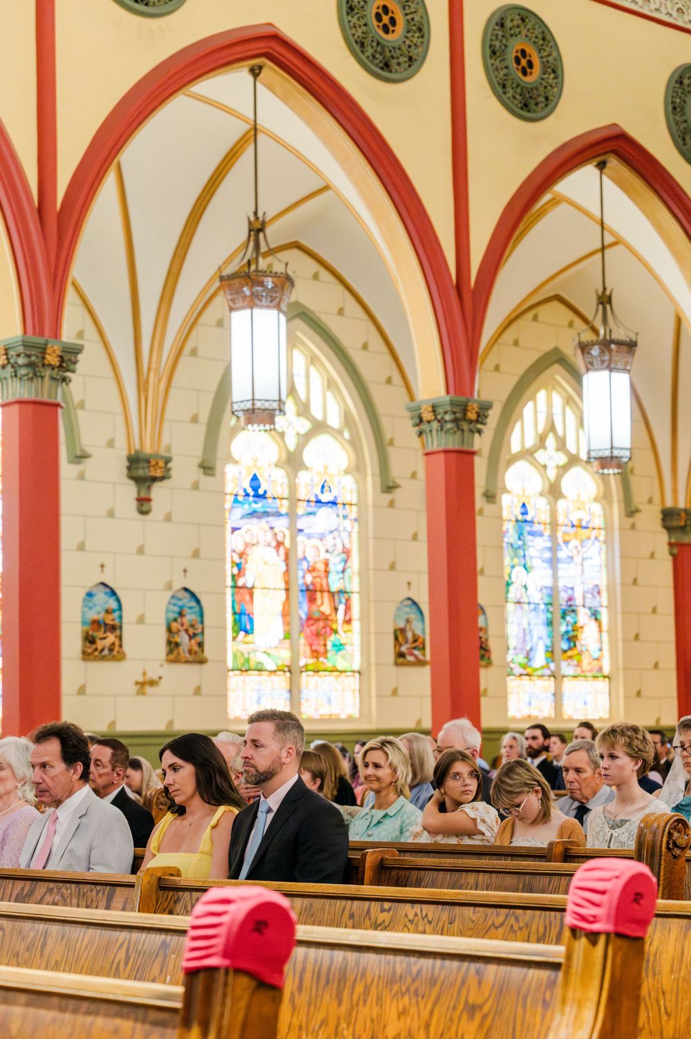 Congregation praying during a Traditional Latin Mass wedding at Holy Family Cathedral in Tulsa, Oklahoma.
