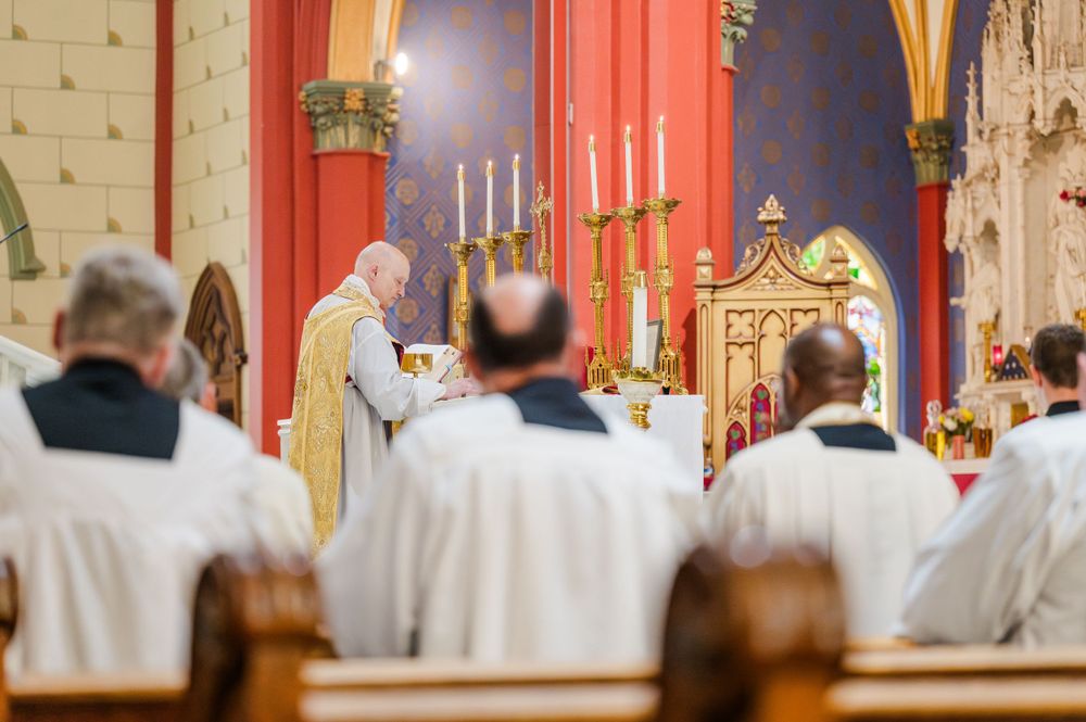 The Priest offers mass during a Traditional Latin Mass wedding at Holy Family Cathedral in Tulsa, Oklahoma.