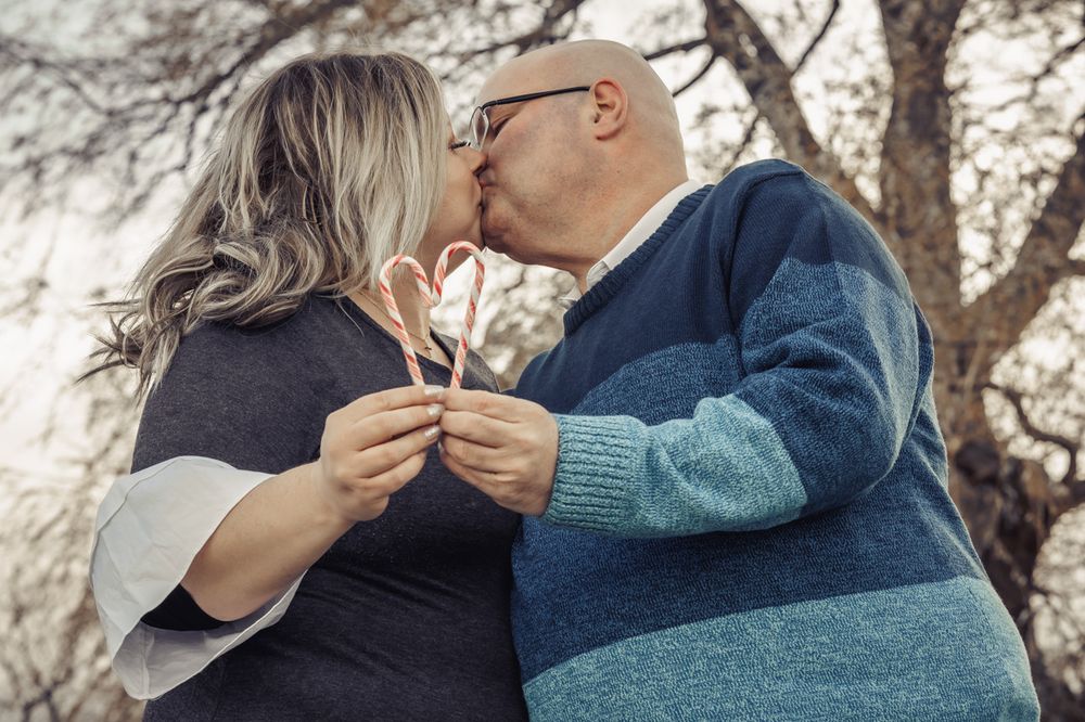 A series of intimate winter portraits showing a couple sharing tender moments.