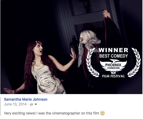 Award-winning dark comedy film still showing two figures in dramatic lighting and gothic styling.