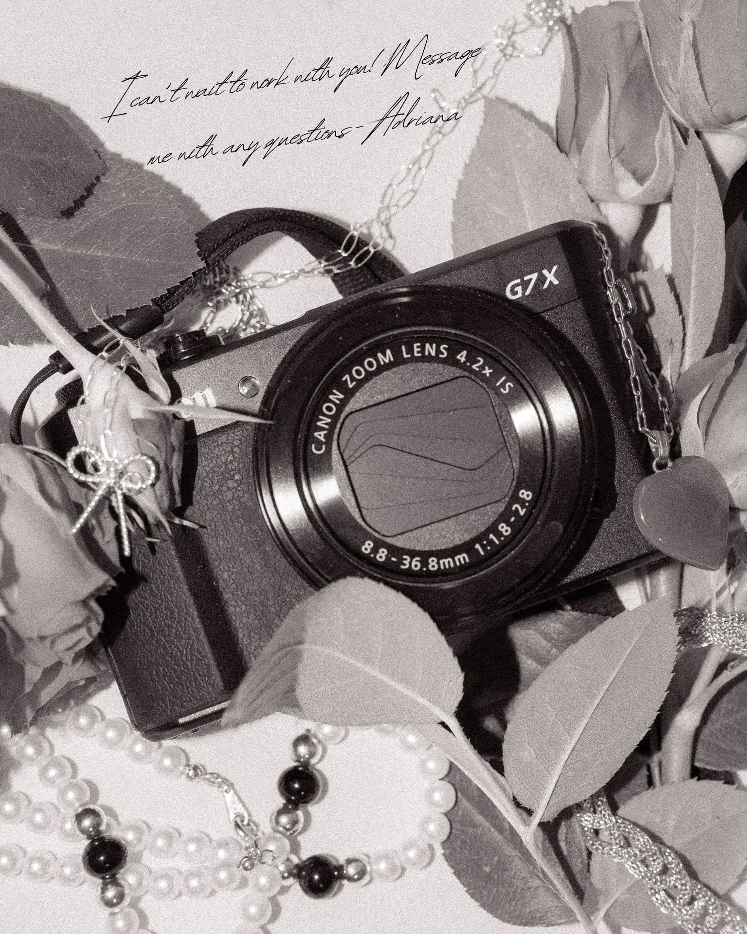 Canon G7X camera with black beaded necklace and eucalyptus leaves in black and white style photography.