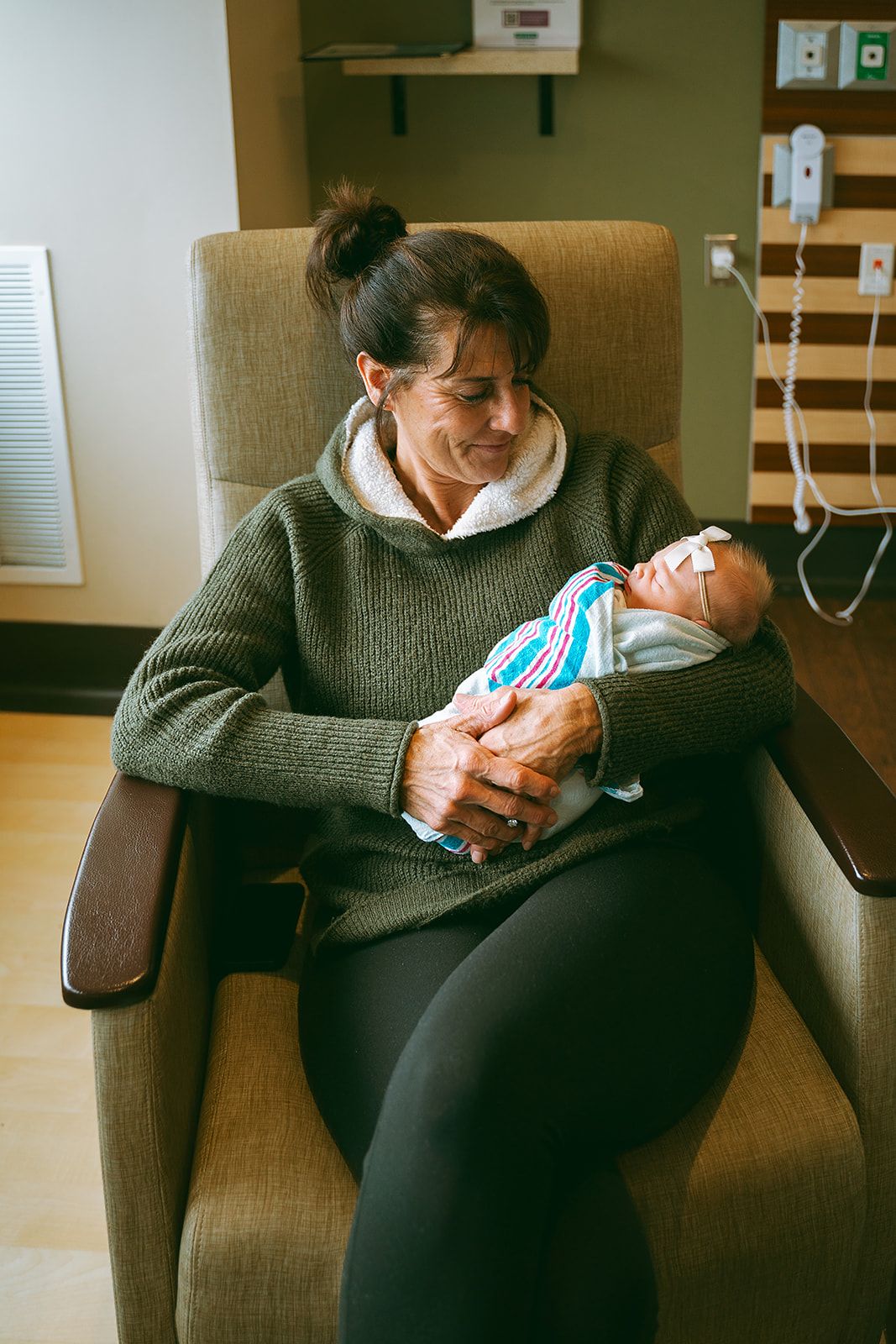 A peaceful scene in a hospital room with someone resting in a chair.