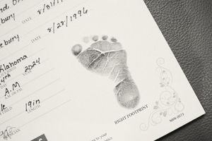 Hospital paperwork and footprint records from a newborn's birth.