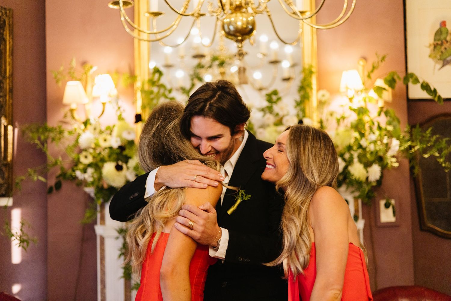 Celebratory moment captured at an elegant indoor event with warm lighting.