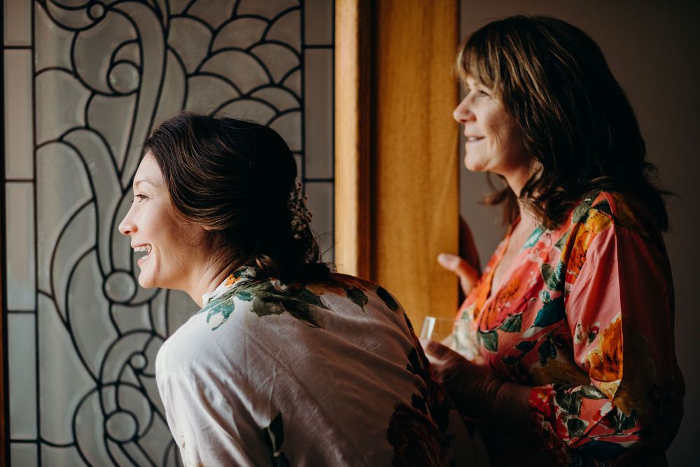 A series of five connected photos showing a person in a floral dress sitting by a window with dramatic lighting.