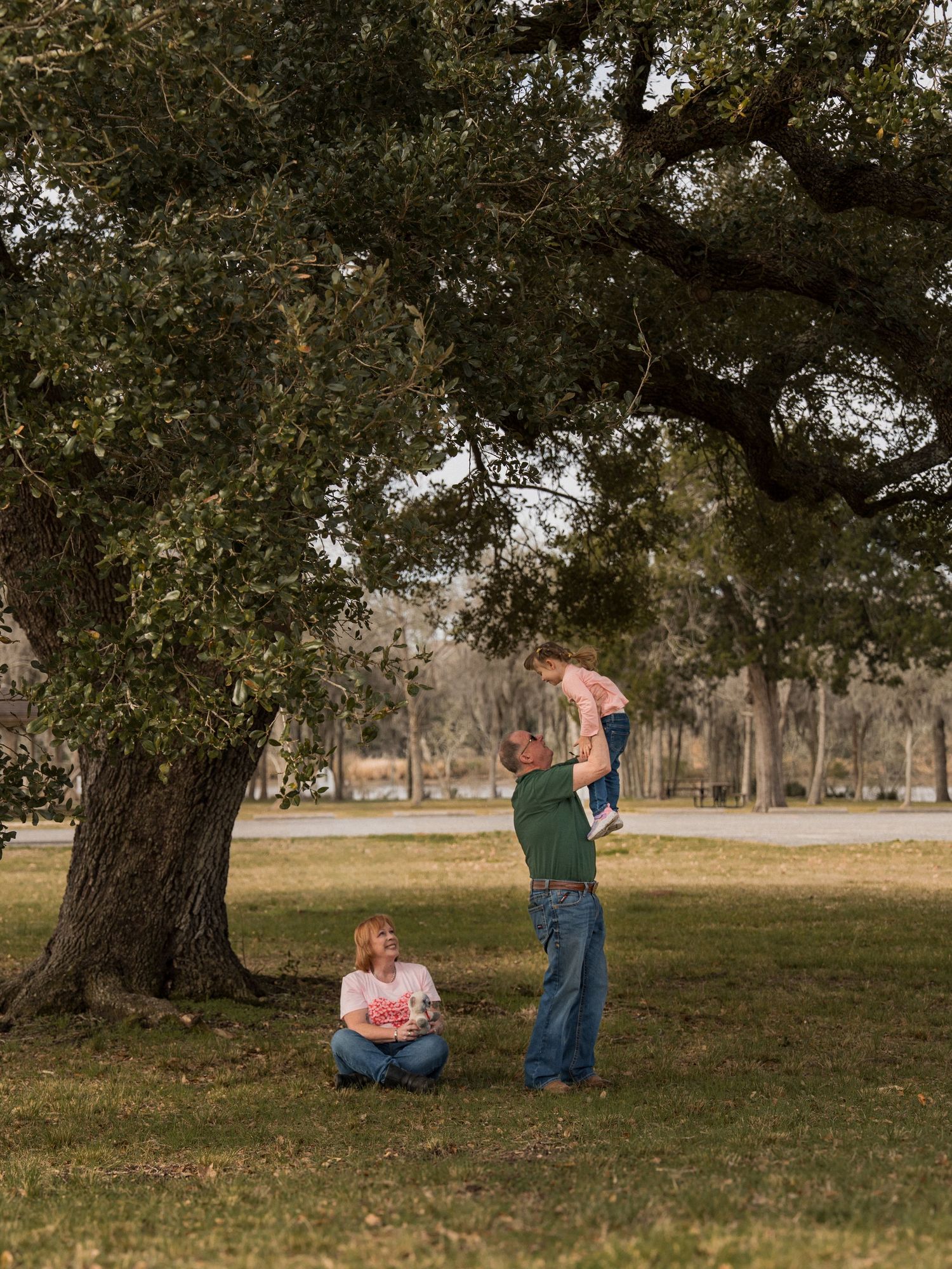 A series of candid outdoor family photos showing affectionate moments between three people in casual attire.