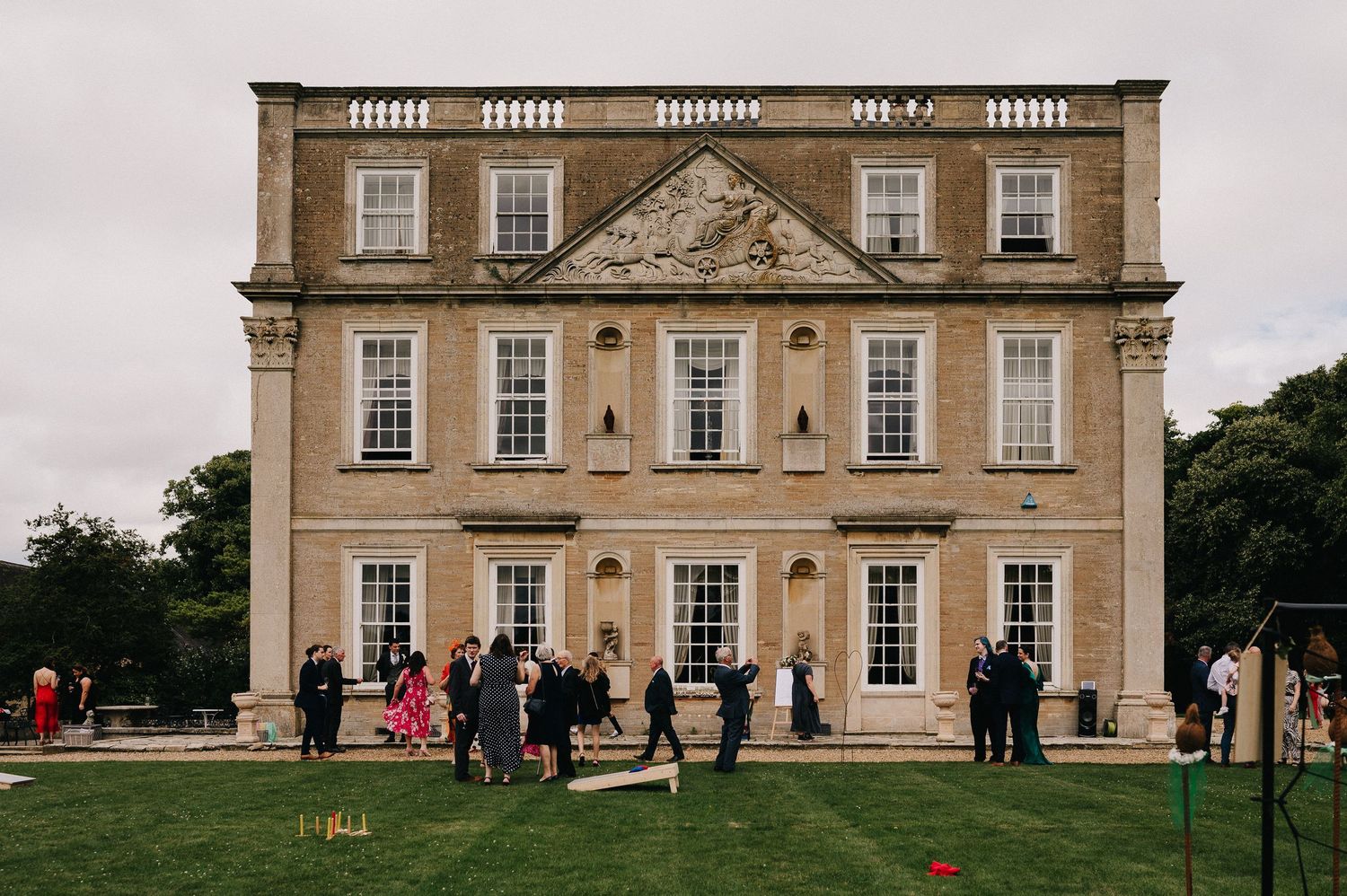 Elegant Georgian manor house with symmetrical windows and classic architectural details shown from multiple exterior angles.