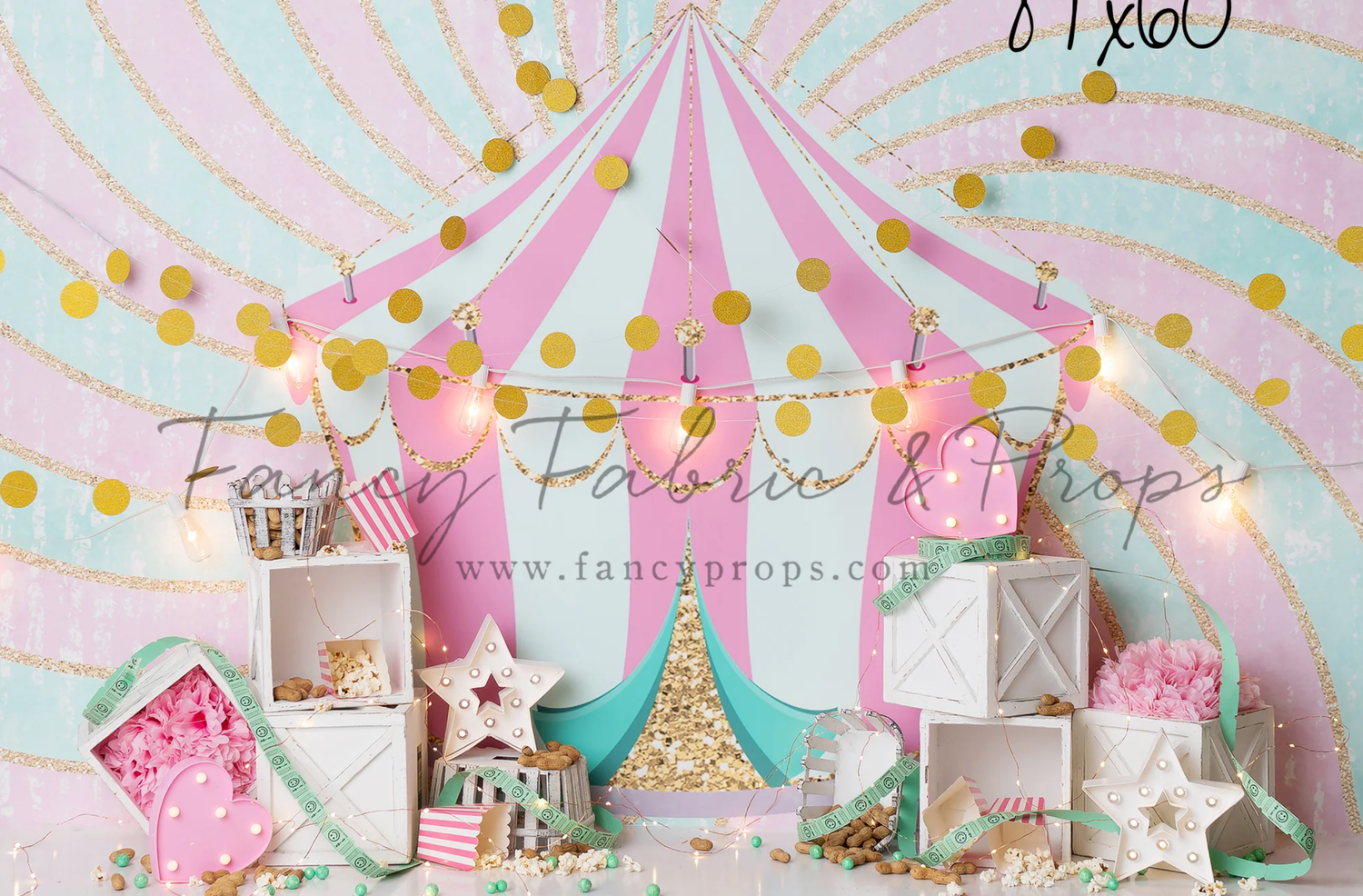 Pink and white circus tent themed party decorations with gold accents and star details create a whimsical celebration setup.