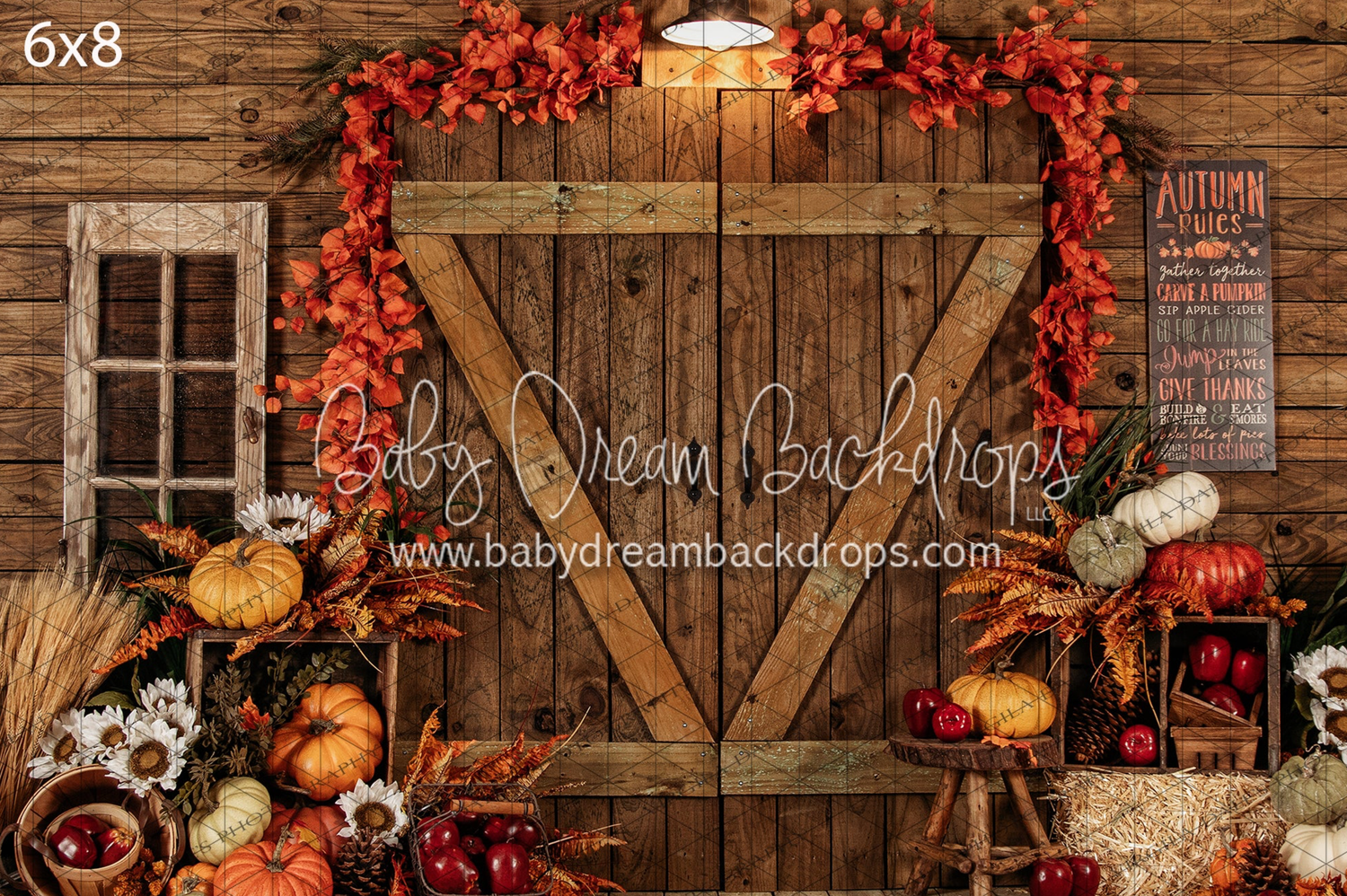 Rustic fall photo backdrop with orange maple leaves, wooden barn door, pumpkins and autumn decor for photography.