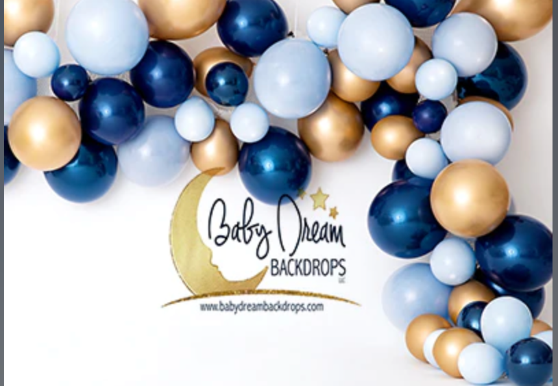 Elegant balloon arch garland in navy blue, gold, and white colors creating a luxurious party decoration display.