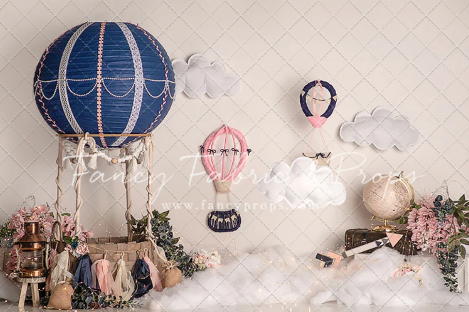 A series of hot air balloon themed nursery decorations in soft blue and pink tones with clouds and floral accents.