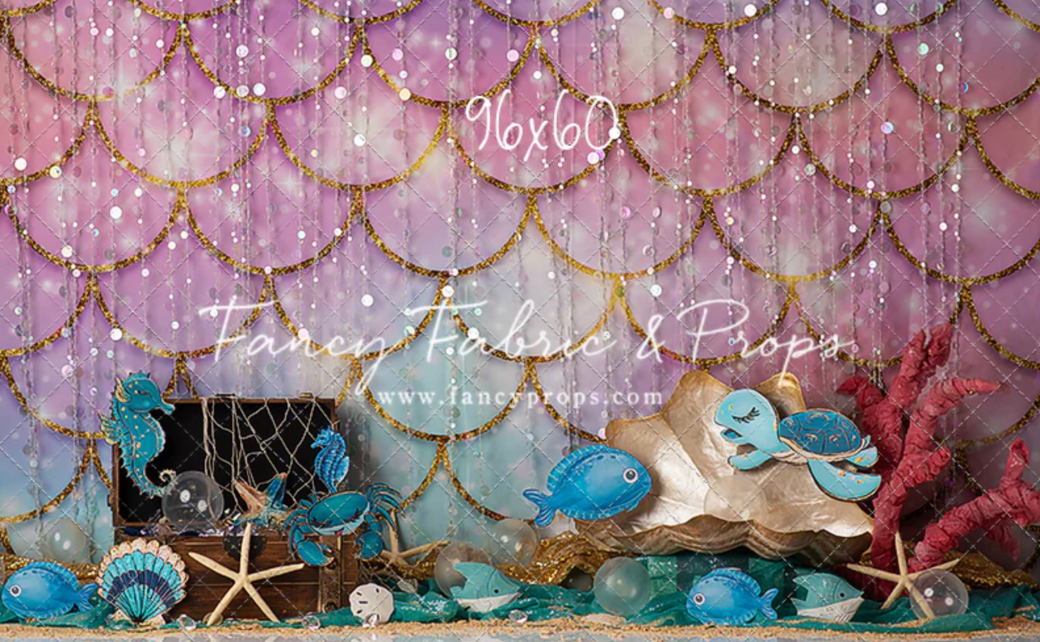 Whimsical beach-themed photo backdrop with starfish, shells, and twinkling lights against a pink and blue ombre background.